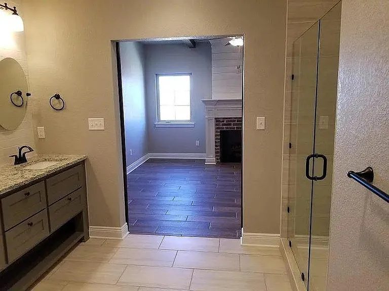 view from main bath into main bedroom