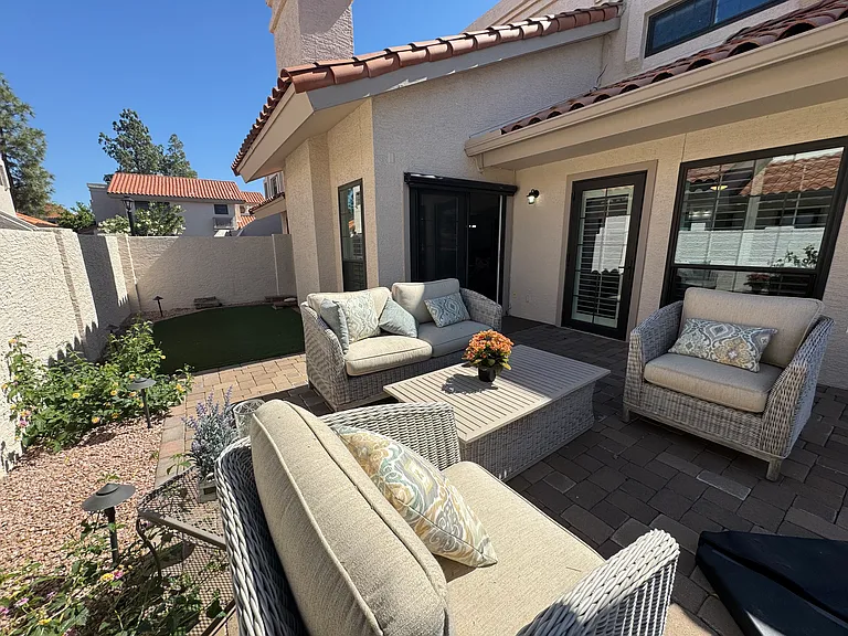 Large Patio, turf area, Slider to Living Room, Door on right to Primary BR