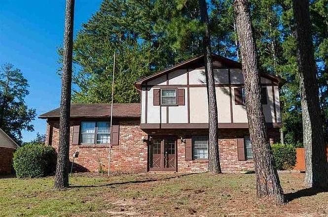 Trees are removed from the yard, giving more yard space and a better look to the property