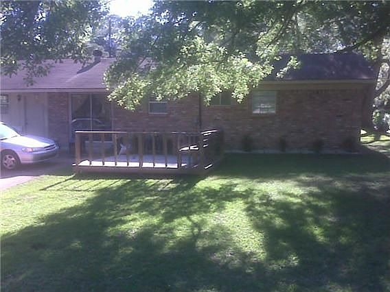 Spacious back yard with deck.