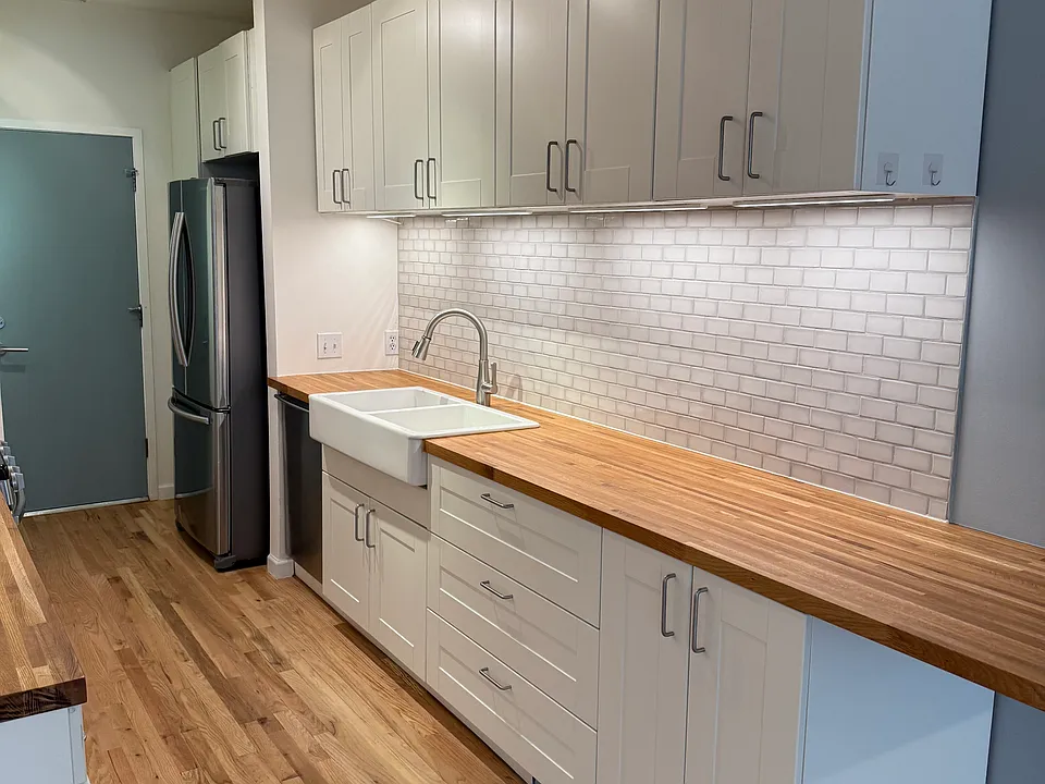 Two pantries in the kitchen by the door leading into the garage.