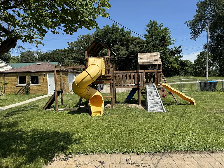 Play yard with detached garage behind