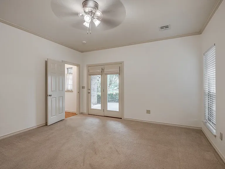 Master Bedroom with doors that go onto patio.