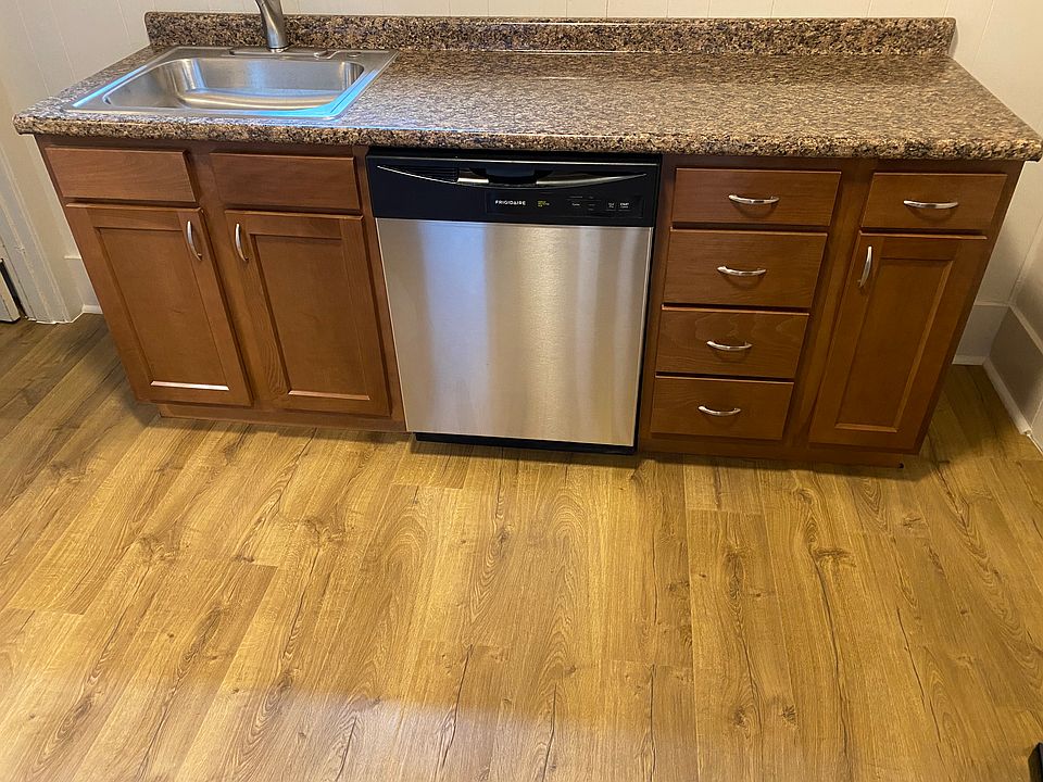 Brand new kitchen including vinyl plank flooring