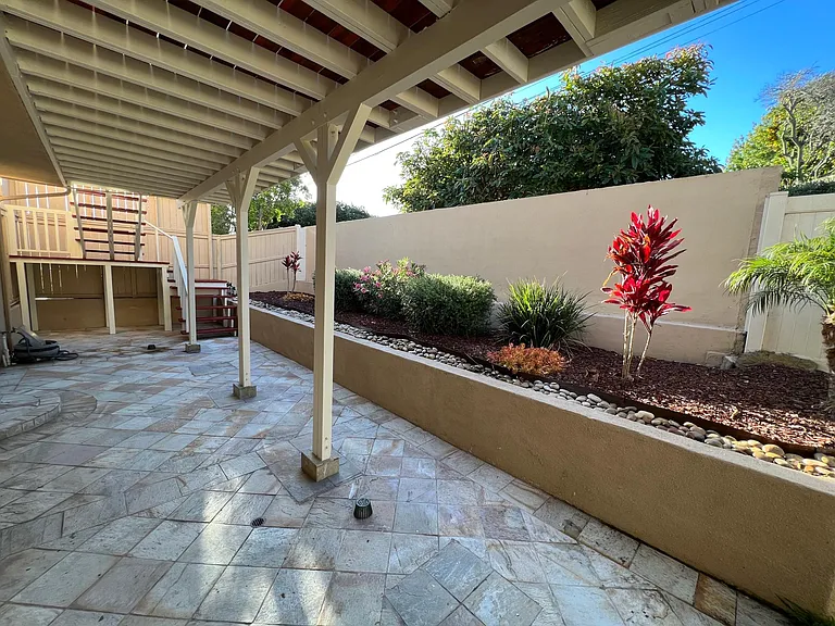 Patio with stairway to upper deck