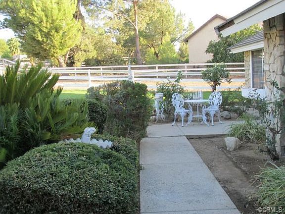 Front walkway from driveway toward entrance.