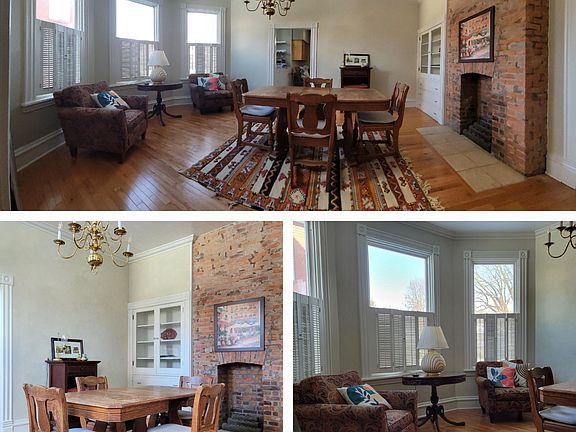 Anchored by windows on one side and a non-working fireplace on the other, this dining room is great for large gatherings. Unfurnished.