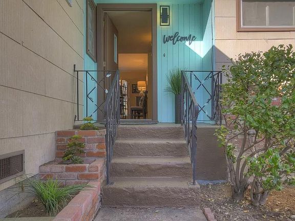 The lovely entrance begins to reveal the stunning character of this Mid Century Charmer.