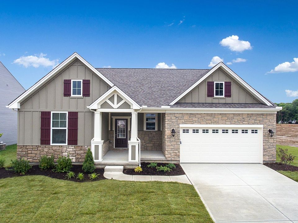 ranch-style home featuring a front porch and front-entry garage
