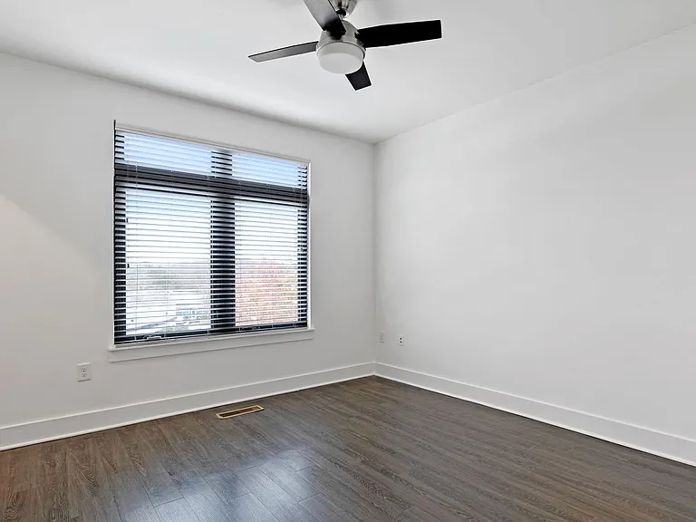 Spacious bedroom with E-Windows and ceiling fans
