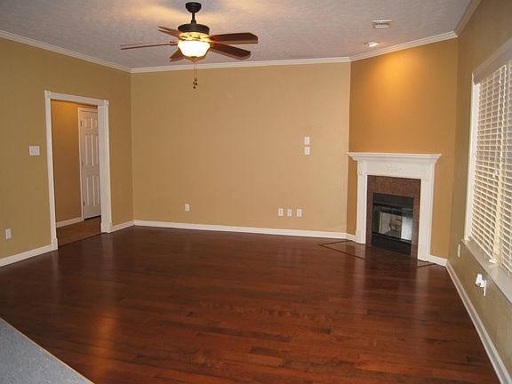 Living room with dark, hardwood floors