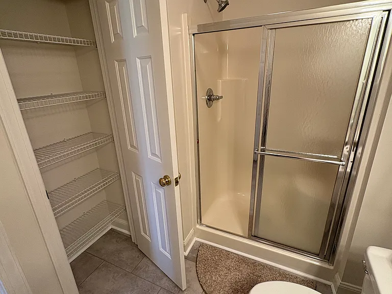 Hallway full bathroom with brand new flooring