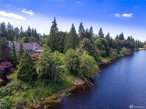 Extraordinary Custom built Gregerson home with 224 feet of lake front in the sought after community of Lake of the Woods in Woodinville.