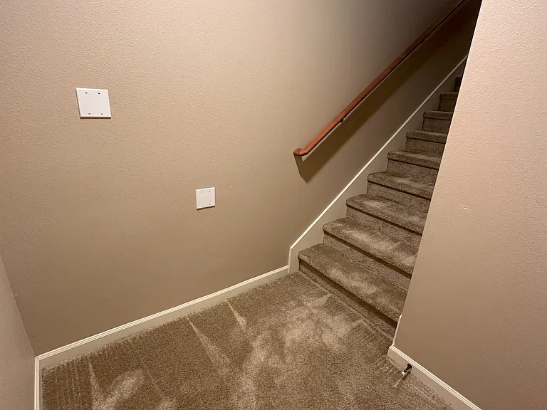 This is a small indoor space at garage level.