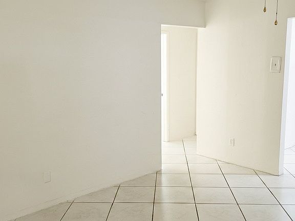 Living Room Facing Hallway and Dining Room