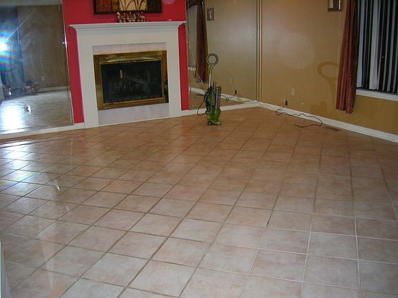 tile in living room, hall, moth bathrooms and master bedroom
