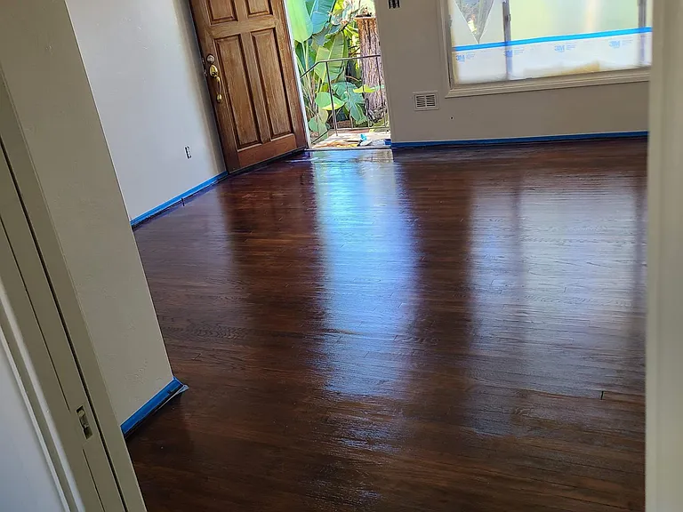 Photo of hardwood floors taken during turnover