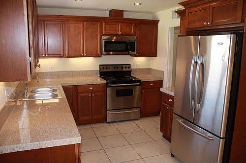 New kitchen, stainless steel appliances, granite countertops, tile floor
