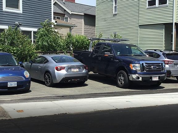 The right 2 of these 4 spots are for 54 Medford. The left 2 are for the blue house which is another detached house on the lot that I own.