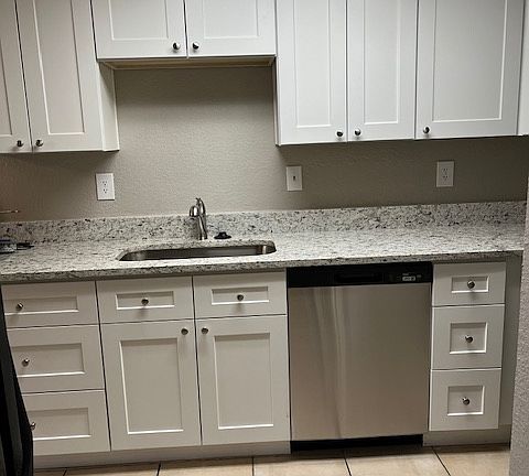 Kitchen from pass-thru to hallway to living room.