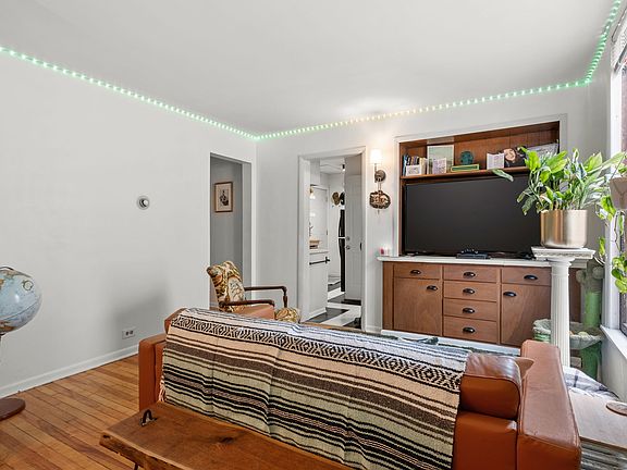 Wood floors, built in cabinets, fresh paint, lots of natural light