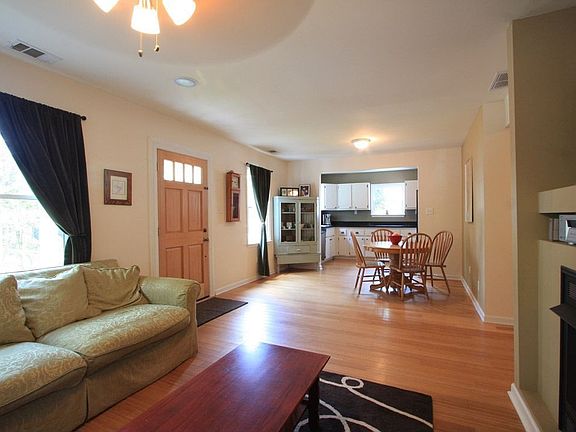 The living room is open to the dining area and the fabulous kitchen.