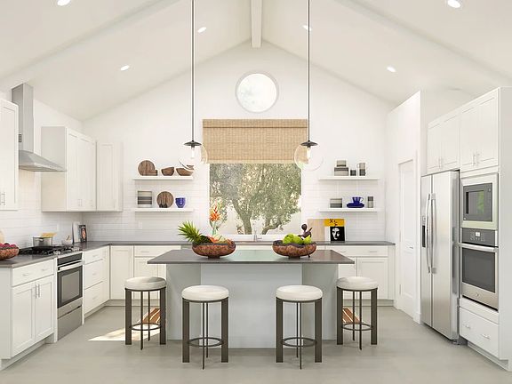 Kitchen with white painted ceiling beams