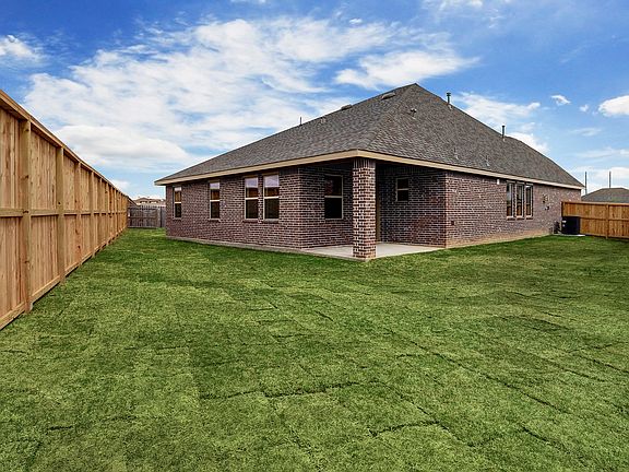 Large backyard with covered patio