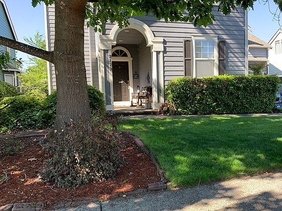 A large red oak tree provides shade to the yard in the summer time.