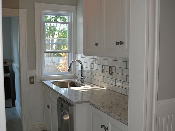 Light & Bright Kitchen with brand new cabinets, tiles, appliances, and quartz countertops. :)
