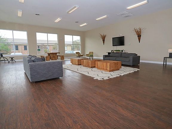 Modern resident lounge with plenty of space for social gatherings and work space.