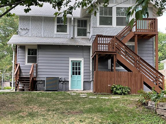 Back view. Yard + second level entry.