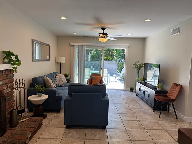 Living room with recessed lighting and fan/light