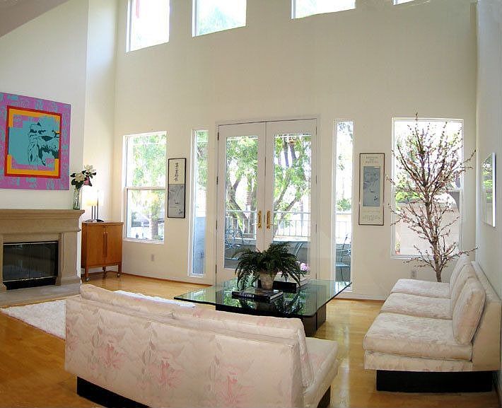 Living Room with Fireplace,Hardwood Floors and Soaring 20 Foot Ceilngs