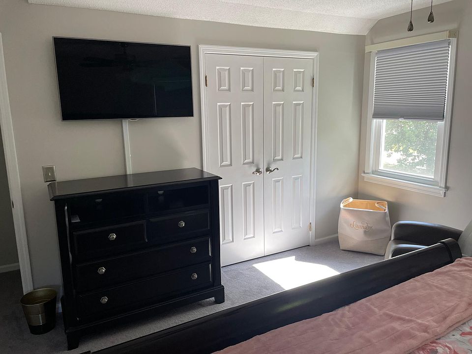 One of the king bedrooms on the second floor. The bedroom set is for sale as the home will be rented without furniture unless renter wants to purchase furniture separately.