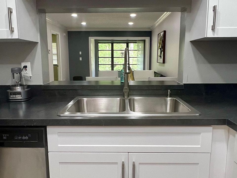 kitchen with pass thru over stainless sink area