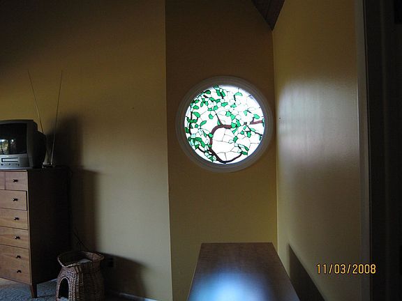 Tasteful stained glass in master suite