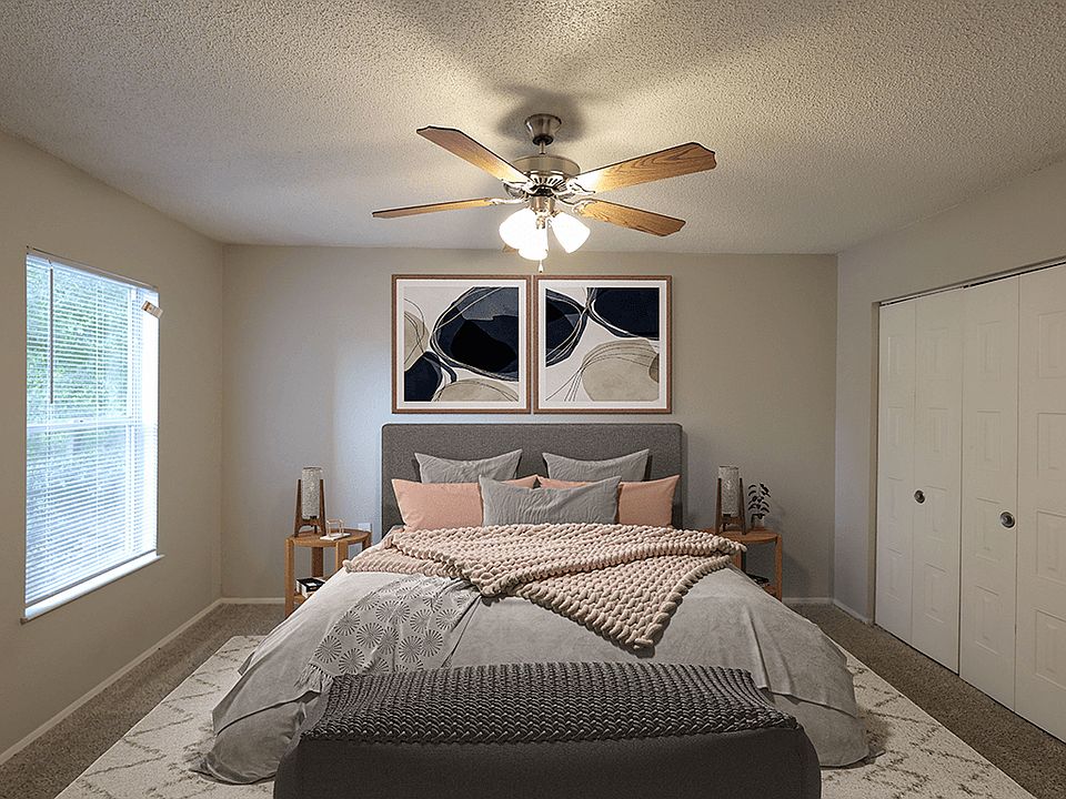 Spacious Carpeted Bedroom with Window