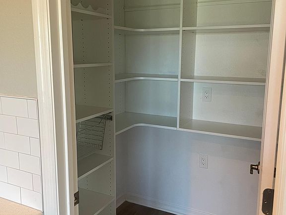 View of pantry with custom shelves