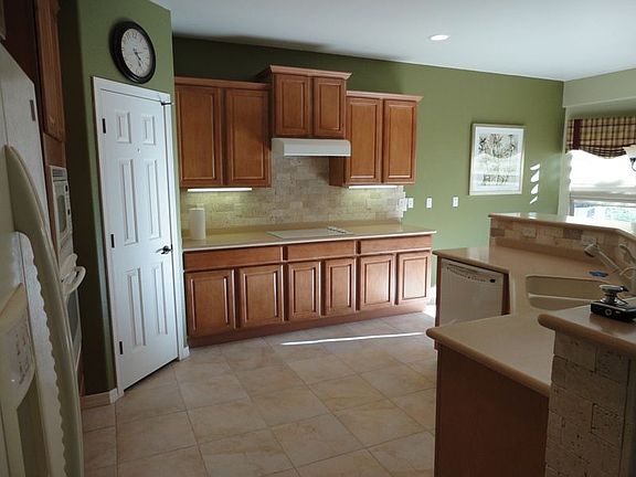 Beautiful kitchen with staggared maple cabinets