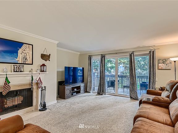 Large living space with wood burning fireplace 