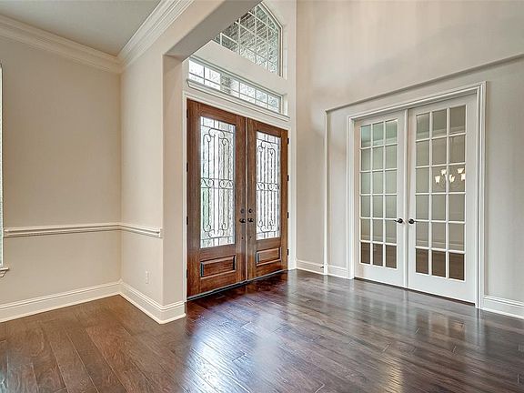 Double door entry, engineered hardwood floors throughout, French doors beckon you into the study.