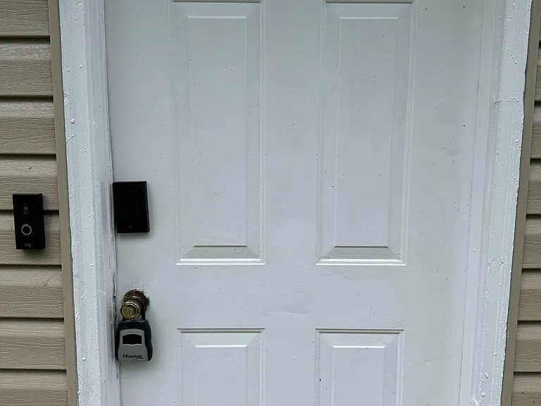 Private exterior entry with bluetooth deadbolt and smart doorbell for convenient access and added security.