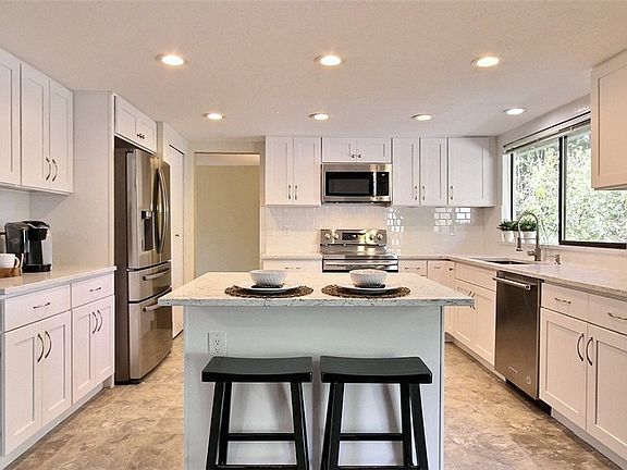 All new chef's delight quartz & stainless steel light & bright kitchen!