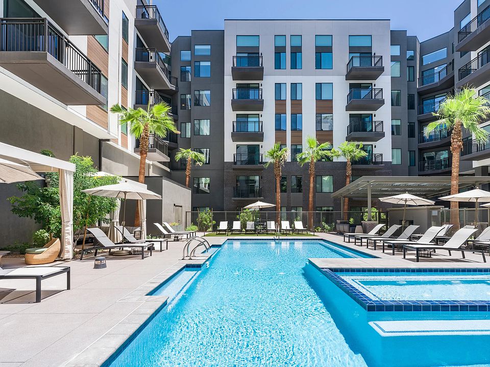 Unwind in the resort-inspired pool courtyard featuring private cabanas, a sun shelf, and ample lounge seating for elevated relaxation.