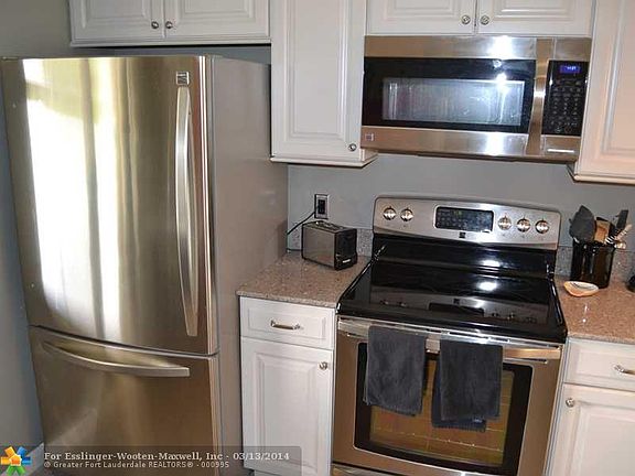 Dual Balcony Penthouse Unit Overlooking Pond and Pool