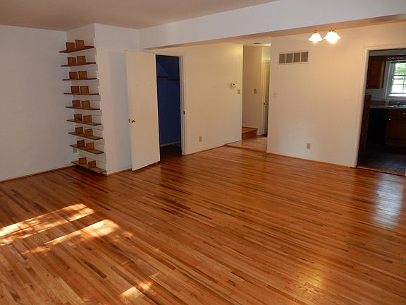 Kitchen/dining room on right. Looking toward front entryway.