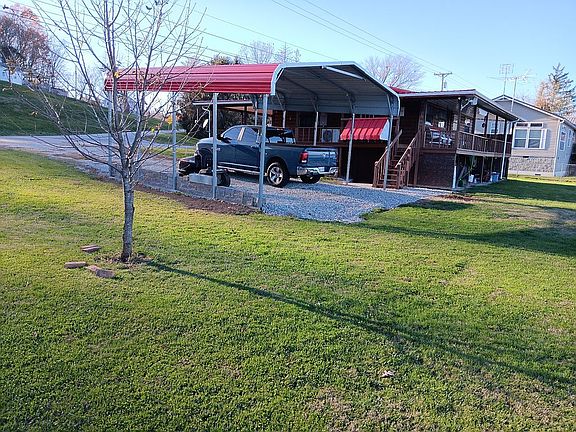 Side lot and carport side of