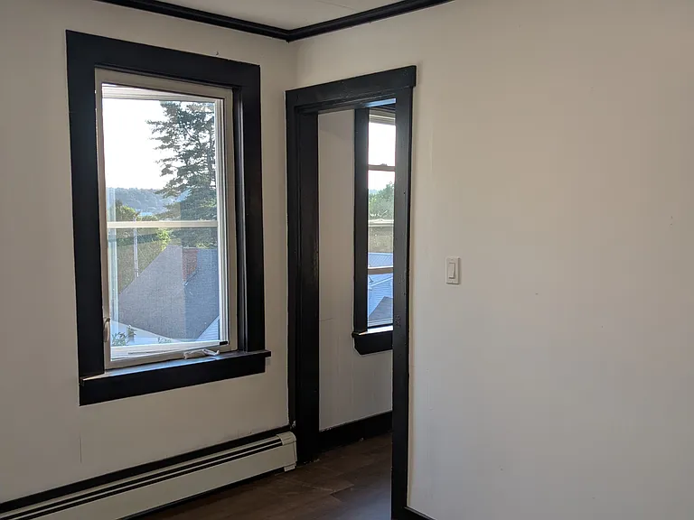 Second bedroom. This view is facing the door to the kitchen.
