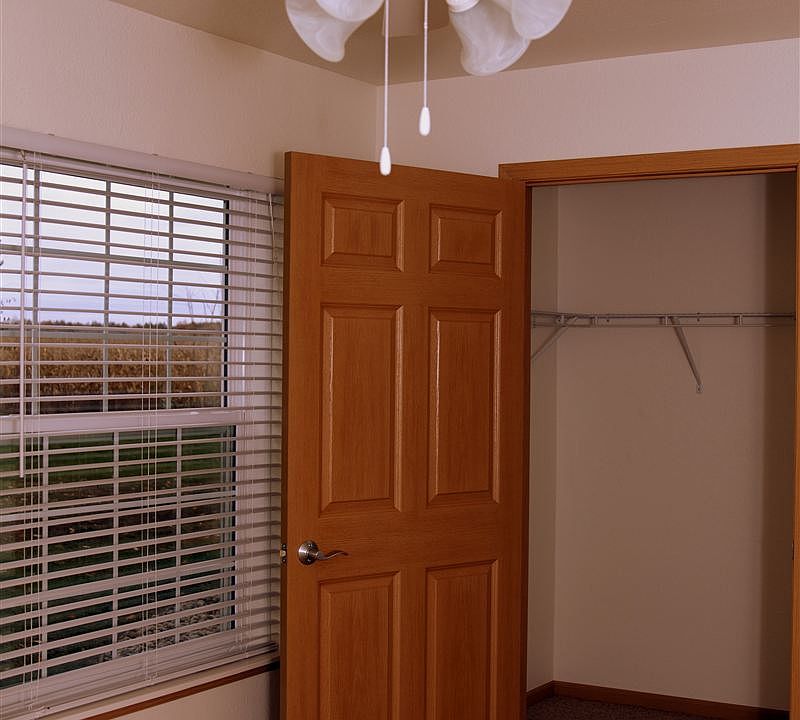 Walk-in closet. Ceiling fan in main bedroom.